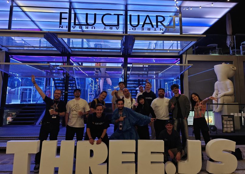 The crew in front of the THREE.JS letters